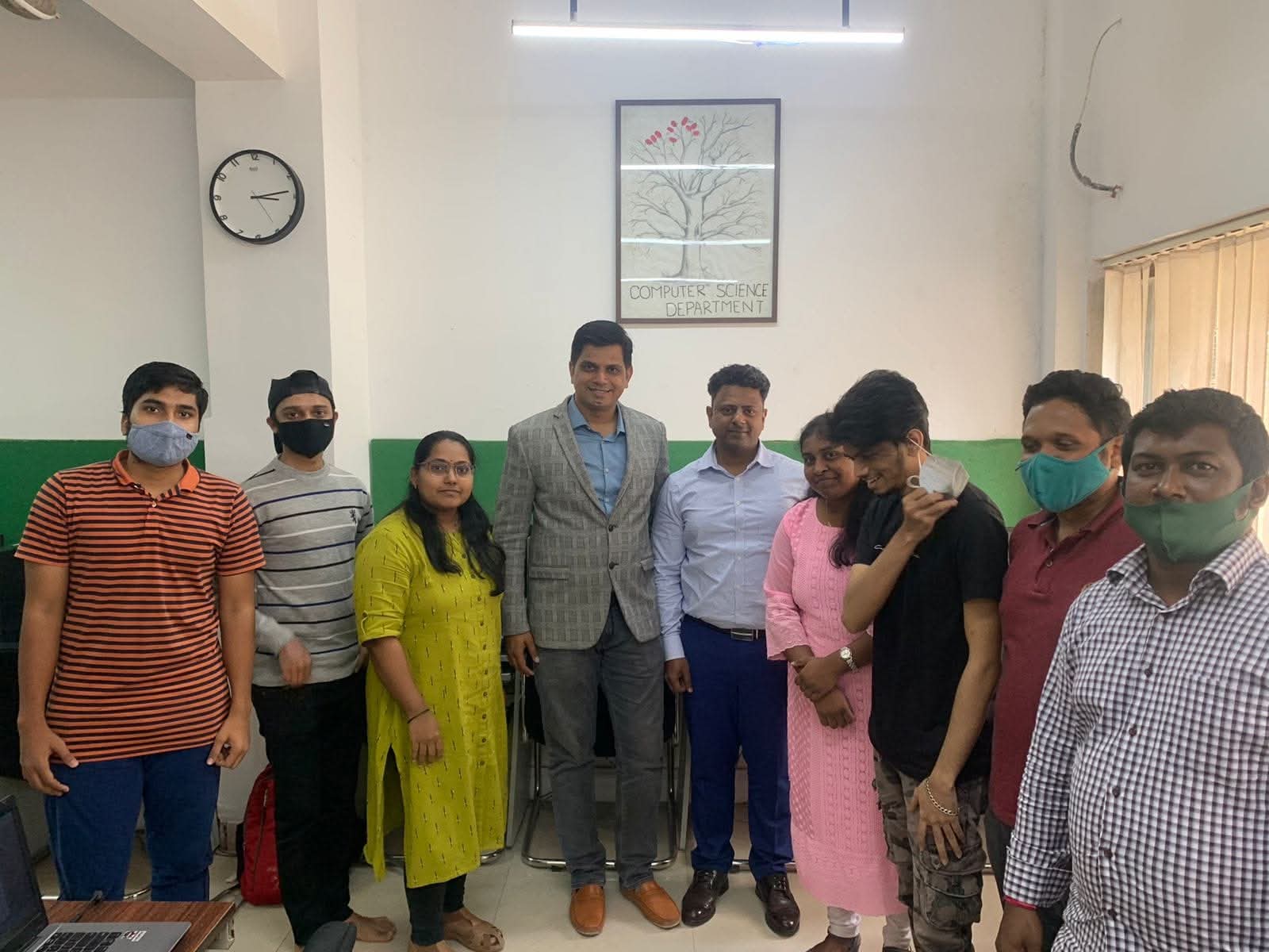 image with teaching staff and students